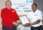 Mike Banda (right) presents du Toit Grobler with the SAIMC certificate after the presentation.